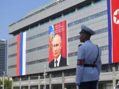 Баннер с портретом Владимира Путина на здании в Пхеньяне. Фото: Кристина Кормилицына / РИА Новости